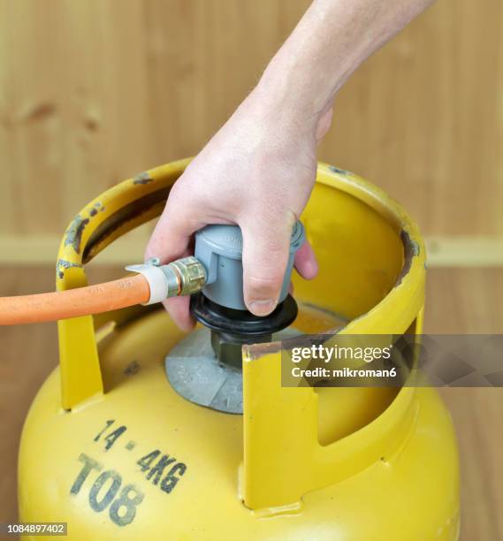 lpg gas bottle, butane gas cylinders - lpg-installation stock pictures, royalty-free photos & images