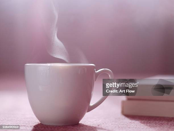 hot tea or coffee and books - hot pink stockfoto's en -beelden