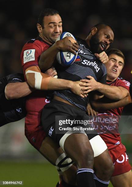 Falcons Vereniki Goneva is tackled by Mamuka Gorgodze and Louis Carbonel during the Champions Cup match between Newcastle Falcons and Toulon at...