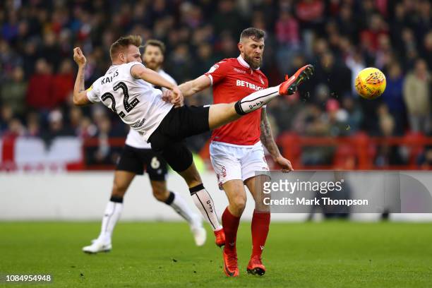 Daryl Murphy of Nottingham Forest battles for possesion with Milan Djuric of Bristol City during the Sky Bet Championship match between Nottingham...