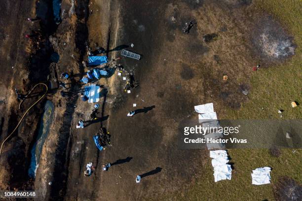Aerial view of the explosion site of a pipeline belonging to Mexican oil company PEMEX on January 19, 2019 in Tlahuelilpan, Mexico. In a statement,...