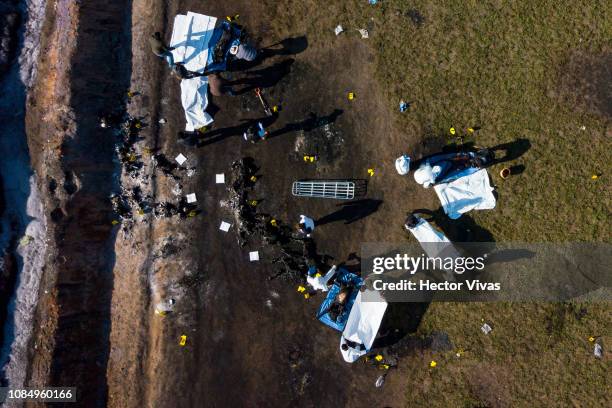 Aerial view of the explosion site of a pipeline belonging to Mexican oil company PEMEX on January 19, 2019 in Tlahuelilpan, Mexico. In a statement,...