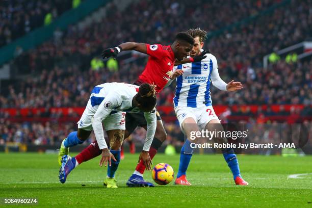 Paul Pogba of Manchester United wins a penalty under a tackle from Gaëtan Bong of Brighton and Hove Albion during the Premier League match between...