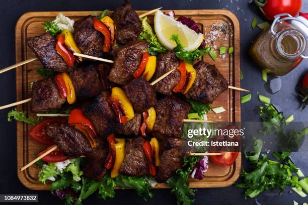 barbecued beef with garnish - skewer stock pictures, royalty-free photos & images