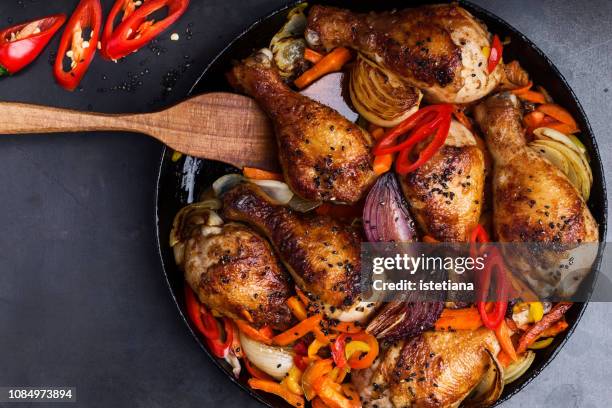 roasted chile miso chicken drumsticks with bell pepper - chicken meat stock pictures, royalty-free photos & images