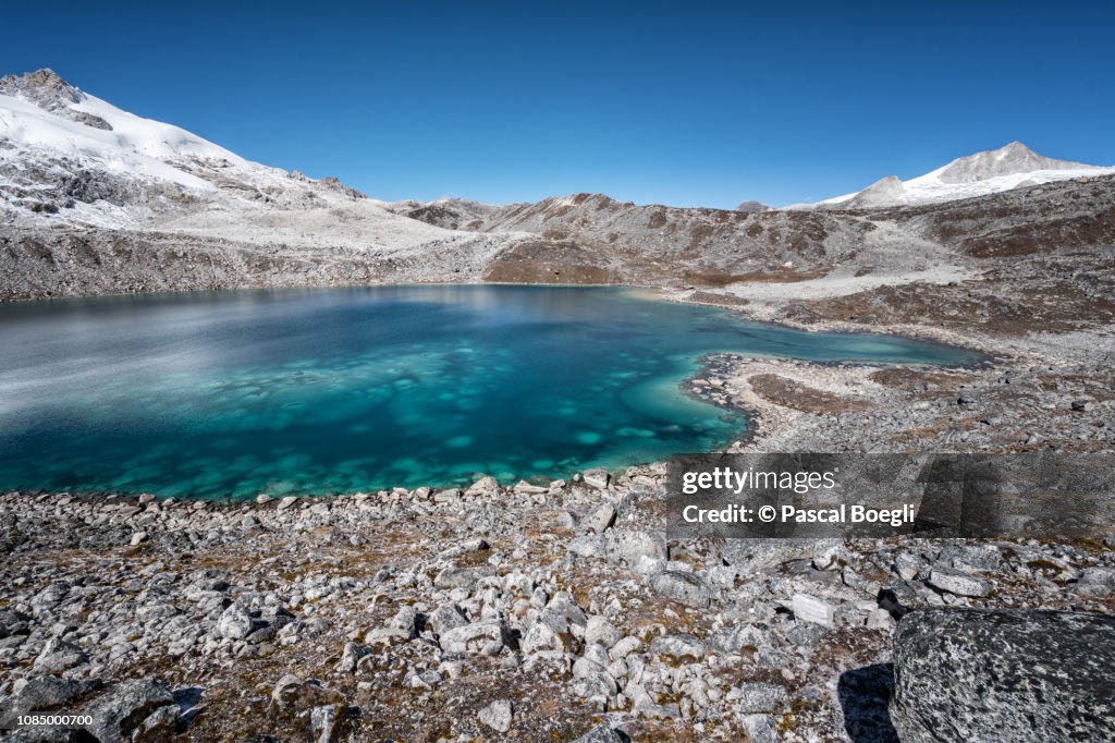 Turquoise lake between Rinchen Zoe La and Chukarpo, Wangdue Phodrang district, Snowman Trek, Bhutan
