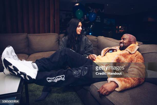 In this handout photo provided by Forum Photos, Kim Kardashian West and Kanye West attend the Travis Scott Astroworld Tour at The Forum on December...