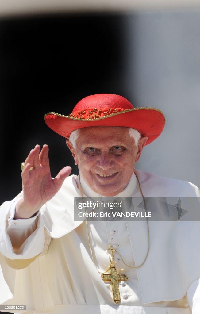 Pope Benedict XVI with his red Saturn hat at the weekly general audience in St. Peter's Square, at the Vatican, on May 20, 2009.