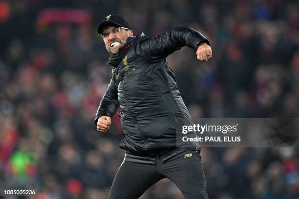 Liverpool's German manager Jurgen Klopp celebrates their victory on the pitch after the English Premier League football match between Liverpool and...