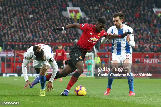Paul Pogba of Man Utd is fouled in the box by Gaetan Bong of Brighton and Davy Propper of Brighton to win a penalty during the Premier League match...