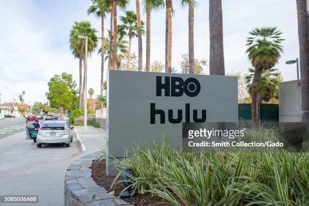 Sign with logos for Home Box Office and Hulu streaming service at regional headquarters in the Silicon Beach area of Los Angeles, California,...
