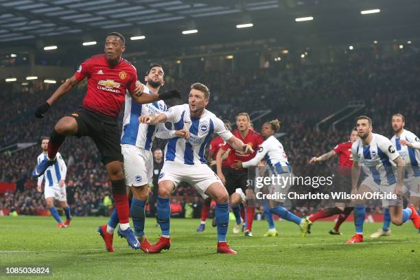 Anthony Martial of Man Utd, Martin Montoya of Brighton and Dale Stephens of Brighton go up for a header during the Premier League match between...