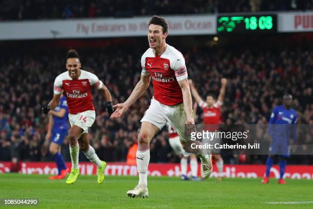 Laurent Koscielny of Arsenal celebrates after scoring his sides second goal during the Premier League match between Arsenal FC and Chelsea FC at...