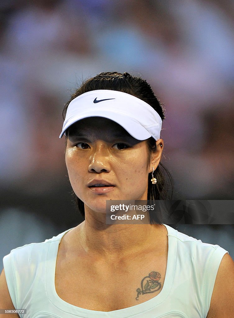 Little Li Na Li Na of China walks on court during her womens singles final against ...