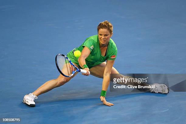 Kim Clijsters of Belgium plays a forehand in her women's final match against Na Li of China during day thirteen of the 2011 Australian Open at...