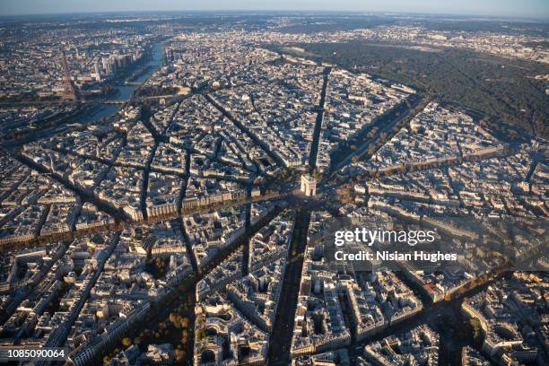 aerial view of arc de triomphe in paris france at sunrise - paris aerial stock pictures, royalty-free photos & images