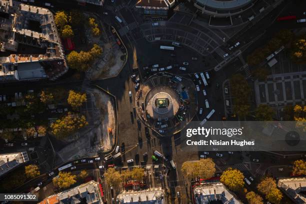 aerial flying over paris france looking down at la bastille, sunrise - bastille paris stock-fotos und bilder