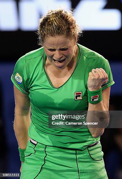 Kim Clijsters of Belgium celebrates winning a point in her women's final match against Na Li of China during day thirteen of the 2011 Australian Open...