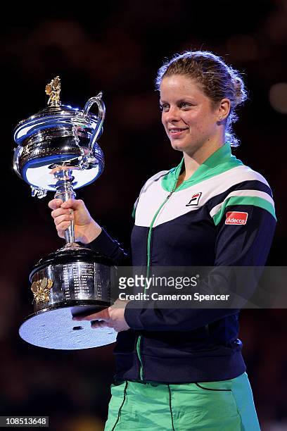 Kim Clijsters of Belgium poses with the Daphne Akhurst Trophy after winning her women's final match against Na Li of China during day thirteen of the...