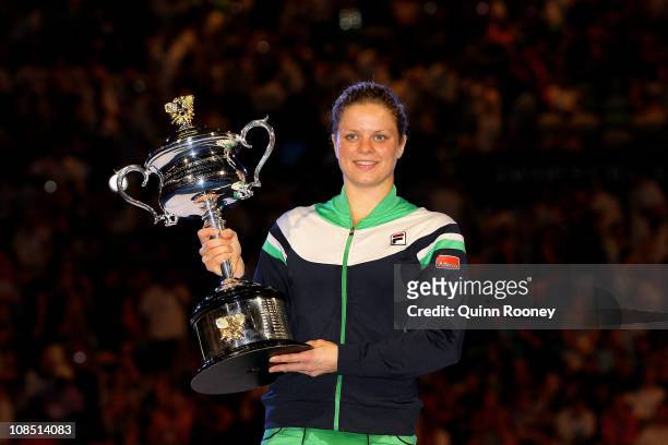 Kim Clijsters of Belgium poses with the Daphne Akhurst Trophy after winning her women's final match against Na Li of China during day thirteen of the...