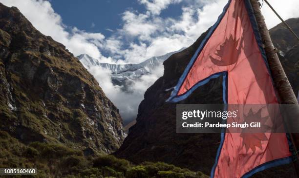 a mountainscape of the annapurna massif in gandaki, nepal. - nepal flag stock pictures, royalty-free photos & images