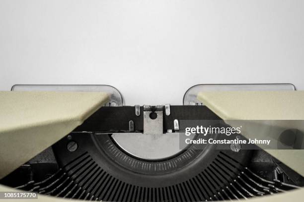 close-up of typewriter with paper - literatur stock-fotos und bilder