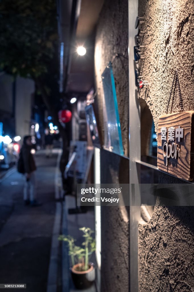 Close up an opening signage of a restaurant on the street, Kyoto, Japan