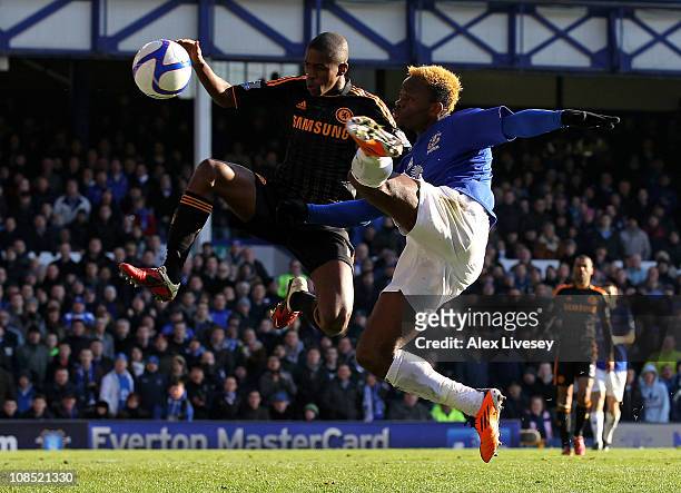 Louis Saha of Everton competes for the ball with Ramires of Chelsea during the FA Cup sponsored by E.On Fourth Round match between Everton and...