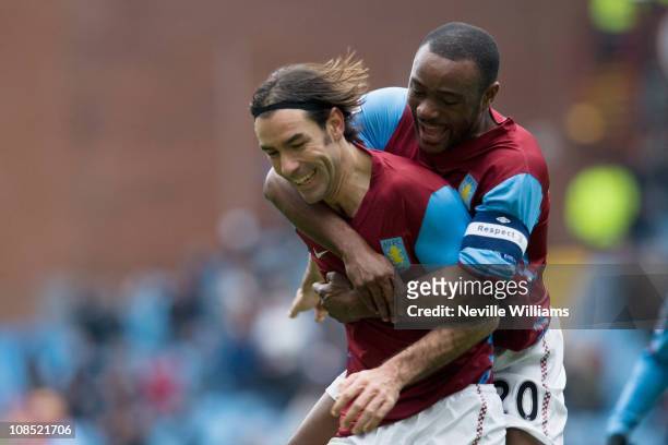 Robert Pires of Aston Villa celebrates with team mate Nigel Reo Coker during the FA Cup sponsored by E.On Fourth Round match between Aston Villa and...