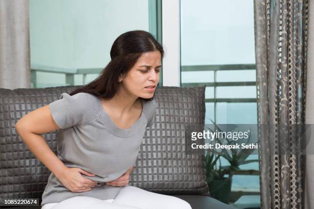 abdominal pain - stock image - problems stock pictures, royalty-free photos & images