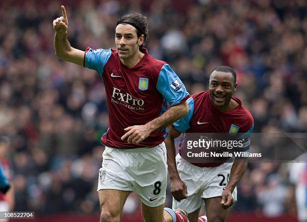 Robert Pires of Aston Villa celebrates with team mate Nigel Reo Coker during the FA Cup sponsored by E.On Fourth Round match between Blackburn Rovers...