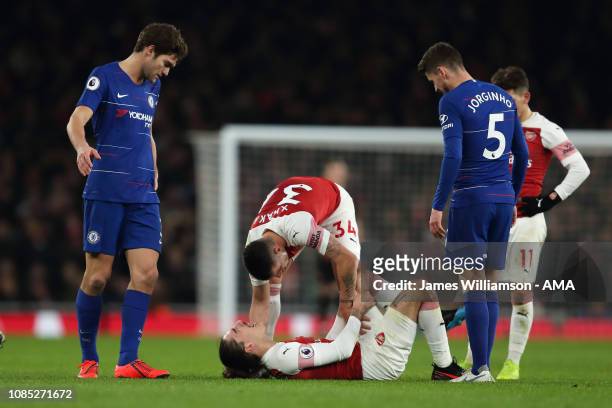 Hector Bellerin of Arsenal goes down injured during the Premier League match between Arsenal FC and Chelsea FC at Emirates Stadium on January 19,...