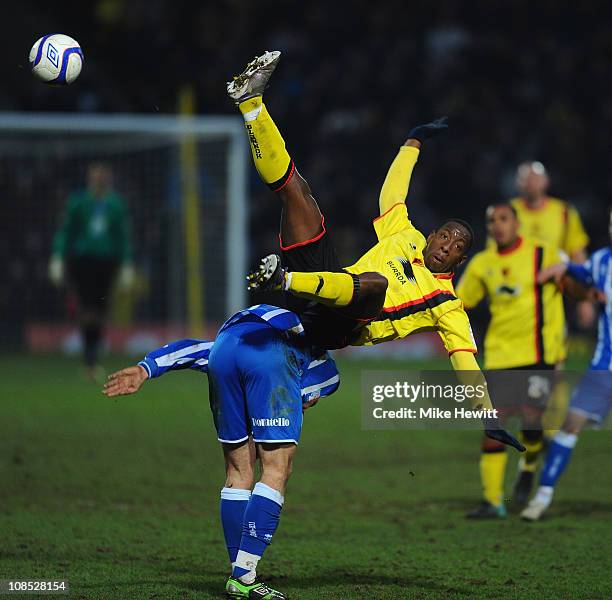 Lloyd Doyley of Watford flies over the top of Glenn Murray of Brighton during the FA Cup Sponsored by E.ON 4th Round match between Watford and...