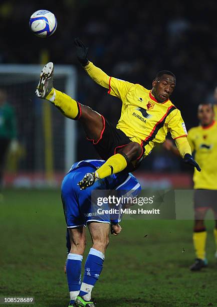 Lloyd Doyley of Watford flies over the top of Glenn Murray of Brighton during the FA Cup Sponsored by E.ON 4th Round match between Watford and...