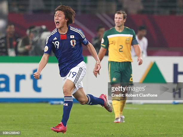 Tadanari Lee of Japan celebrates his goal in extra time during the AFC Asian Cup Final match between the Australian Socceroos and Japan at Khalifa...