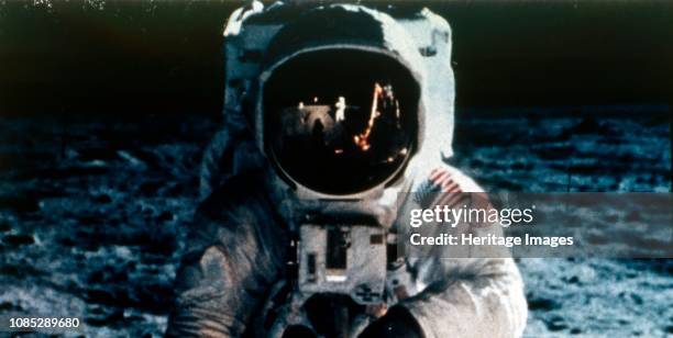 Buzz Aldrin on the Moon, Apollo II mission, July 1969. Reflected in Aldrin's visor are Neil Armstrong taking the photograph, the US flag, and the...