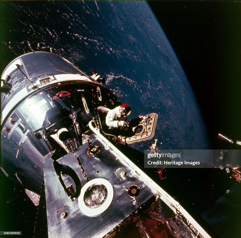 Module pilot David Scott emerging from Apollo 9 spacecraft, 6 March ...