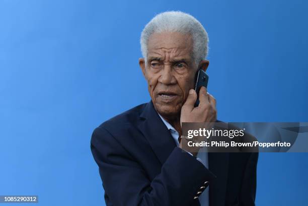 Sir Garfield Sobers speaks on the phone during a West Indies training session at Kensington Oval on January 19, 2019 in Bridgetown, Barbados.