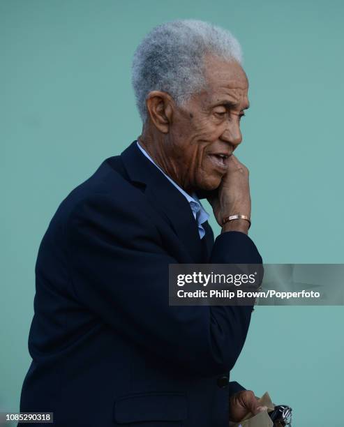 Sir Garfield Sobers speaks on the phone during a West Indies training session at Kensington Oval on January 19, 2019 in Bridgetown, Barbados.