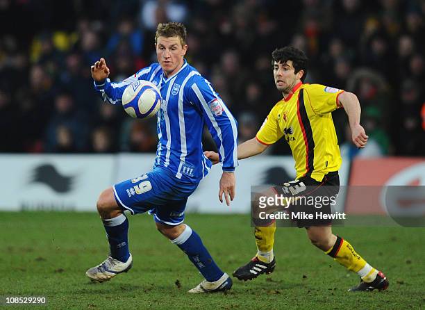 Chris Wood of Brighton is challenged by Piero Mingoia of Watford during the FA Cup Sponsored by E.ON 4th Round match between Watford and Brighton &...