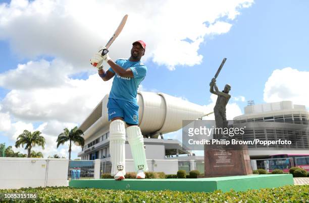 Darren Bravo poses for a photograph in front of the Sir Garfield Sobers statue during a West Indies training session at Kensington Oval on January...