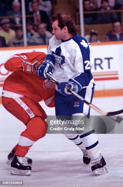 Dave Semenko of the Toronto Maple Leafs skates against Doug Halward of the Detroit Red Wings on December 7, 1987 at Maple Leaf Gardens in Toronto,...