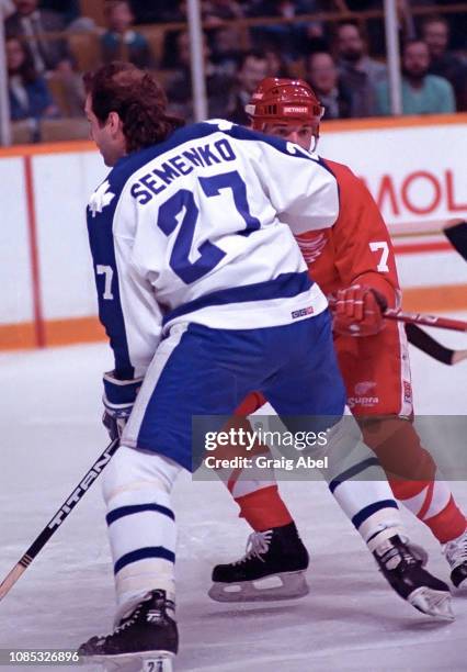 Dave Semenko of the Toronto Maple Leafs skates against Doug Halward of the Detroit Red Wings on December 7, 1987 at Maple Leaf Gardens in Toronto,...