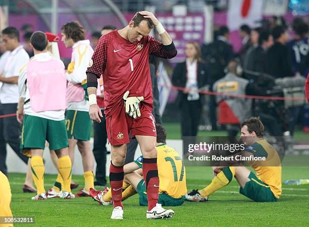 Australian goalkeeper Mark Schwarzer looks dejected after Japan defeated Australia in extra time 1-0 at the AFC Asian Cup Final match between the...