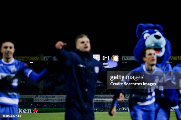 Players of PEC Zwolle celebrates the victory after the game behind the scorebord with 3-1 stand during the Dutch Eredivisie match between PEC Zwolle...