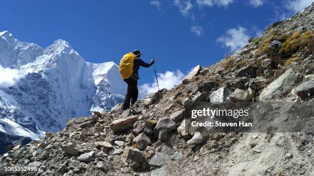 self-portrait when climbing mountains towards everest base camp in tibet, china - mt everest base camp stock pictures, royalty-free photos & images