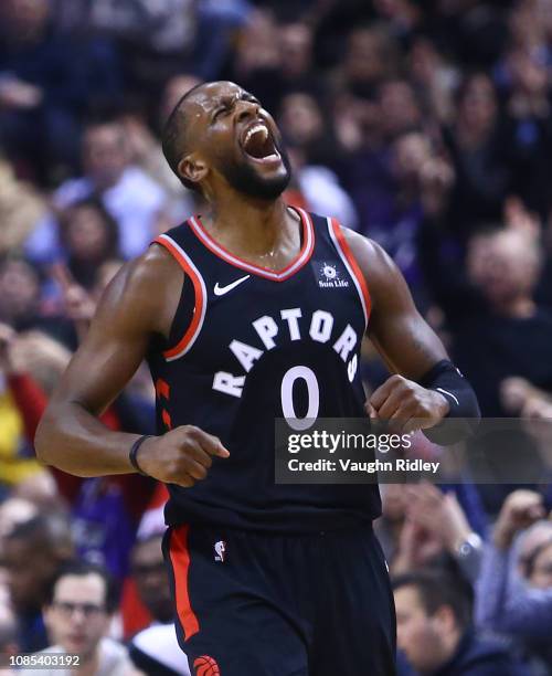 Miles of the Toronto Raptors celebrates after sinking a 3 pointer during the first half of an NBA game against the Memphis Grizzlies at Scotiabank...