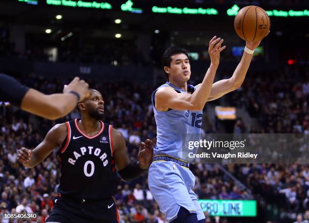 Yuta Watanabe of the Memphis Grizzlies passes the ball as C.J. Miles of the Toronto Raptors defends during the 2nd half of an NBA game at Scotiabank...