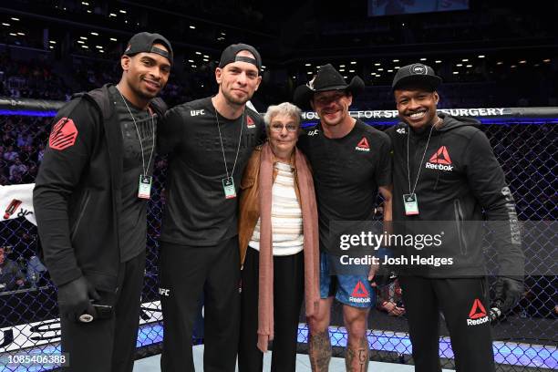 Donald Cerrone poses for a photo with his team and grandmother following his TKO victory over Alexander Hernandez in their lightweight bout during...