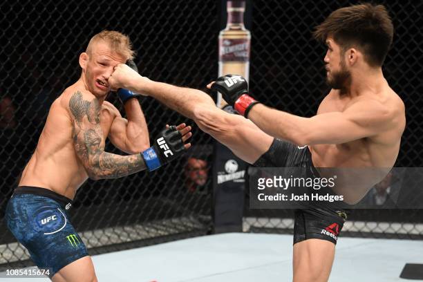Henry Cejudo kicks TJ Dillashaw in their flyweight bout during the UFC Fight Night event at the Barclays Center on January 19, 2019 in the Brooklyn...